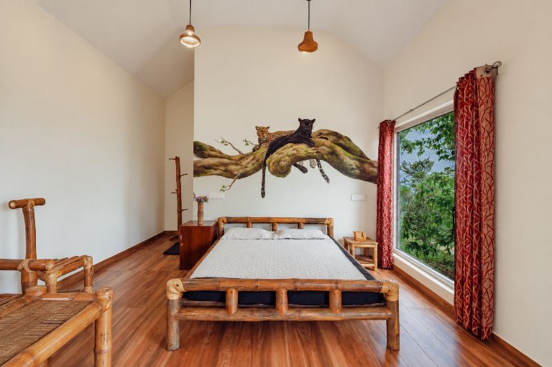 Bamboo bed room with a painted panther and leopard mural