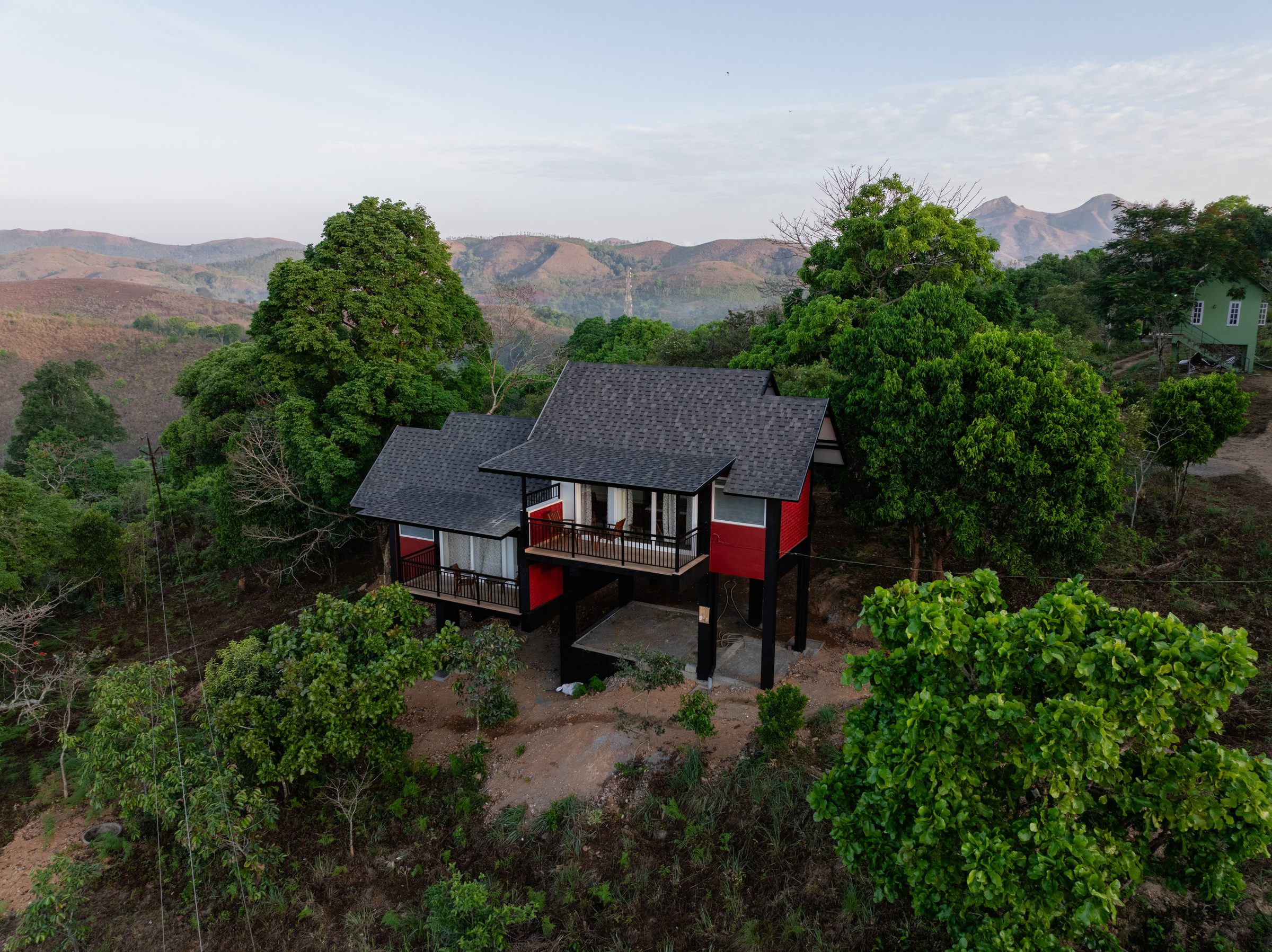 Aerial view of a Genepool Eco Tourism cottage nestled in the Western Ghats forest