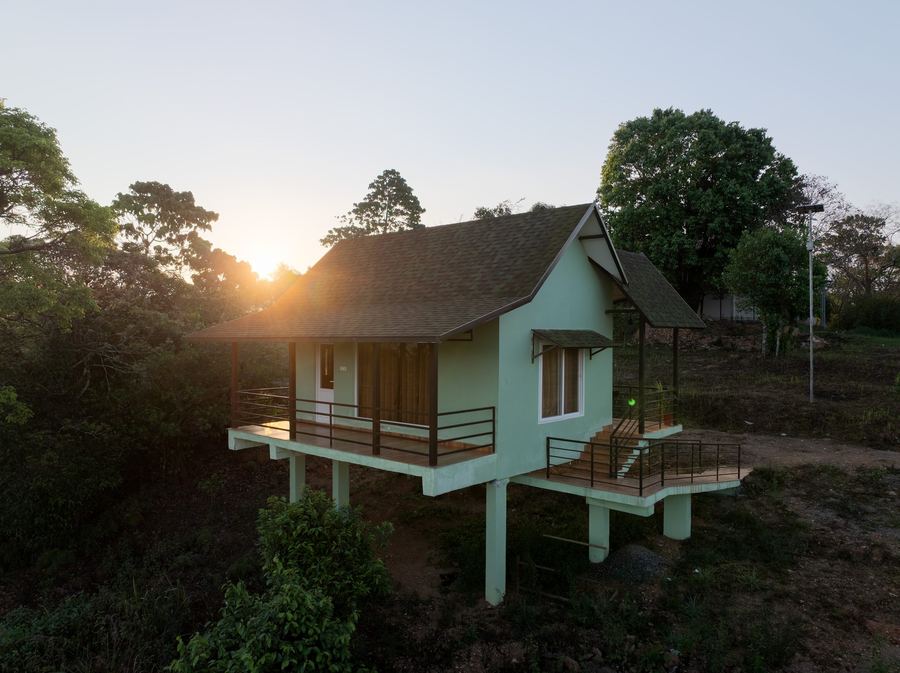 Cottage at sunset overlooking the Western Ghats hills