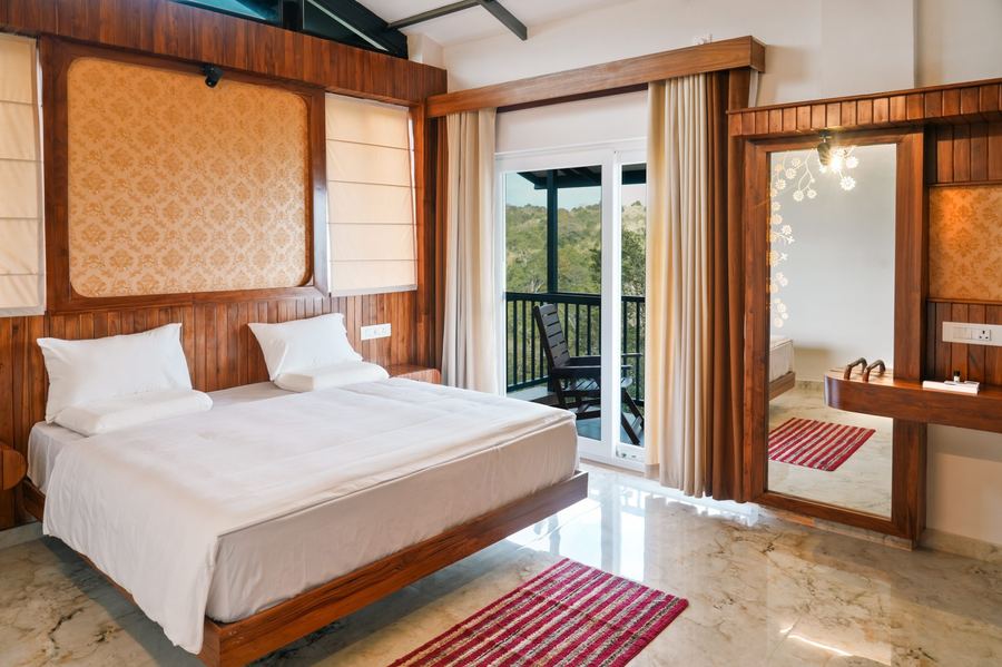 Comfortable wood-panelled room with forest view